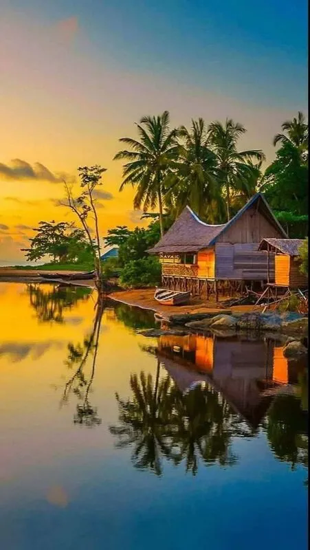 Con đường làng lát gạch đỏ quanh co, hai bên là những hàng rào hoa giấy rực rỡ, một góc ảnh làng quê đẹp và thân thuộc cho điện thoại.